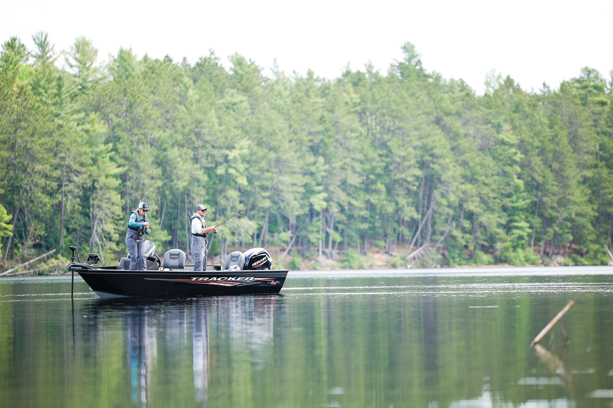 Two people on a fishing boat on the water, boats and buoyancy concept. 