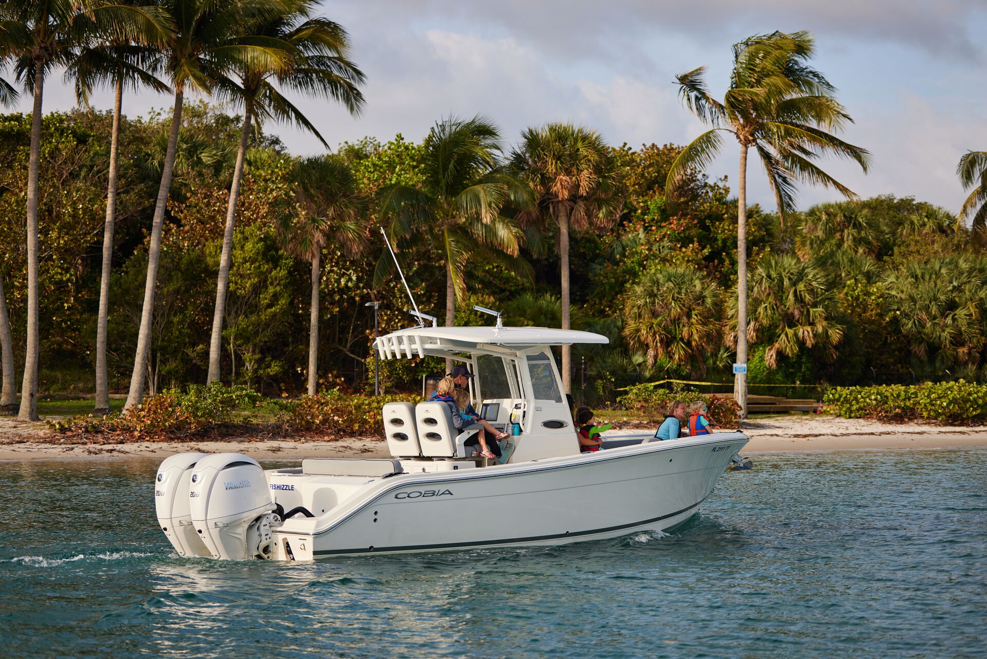 A boat floating near the shoreline. 