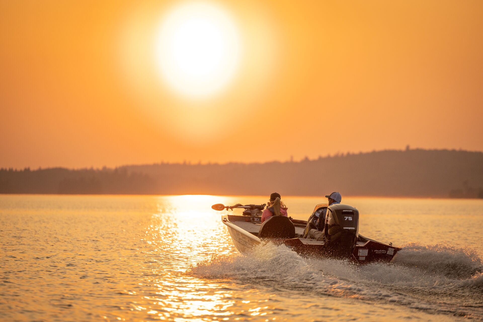 Driving a fishing boat at sunset, minnesota boating regulations concept.