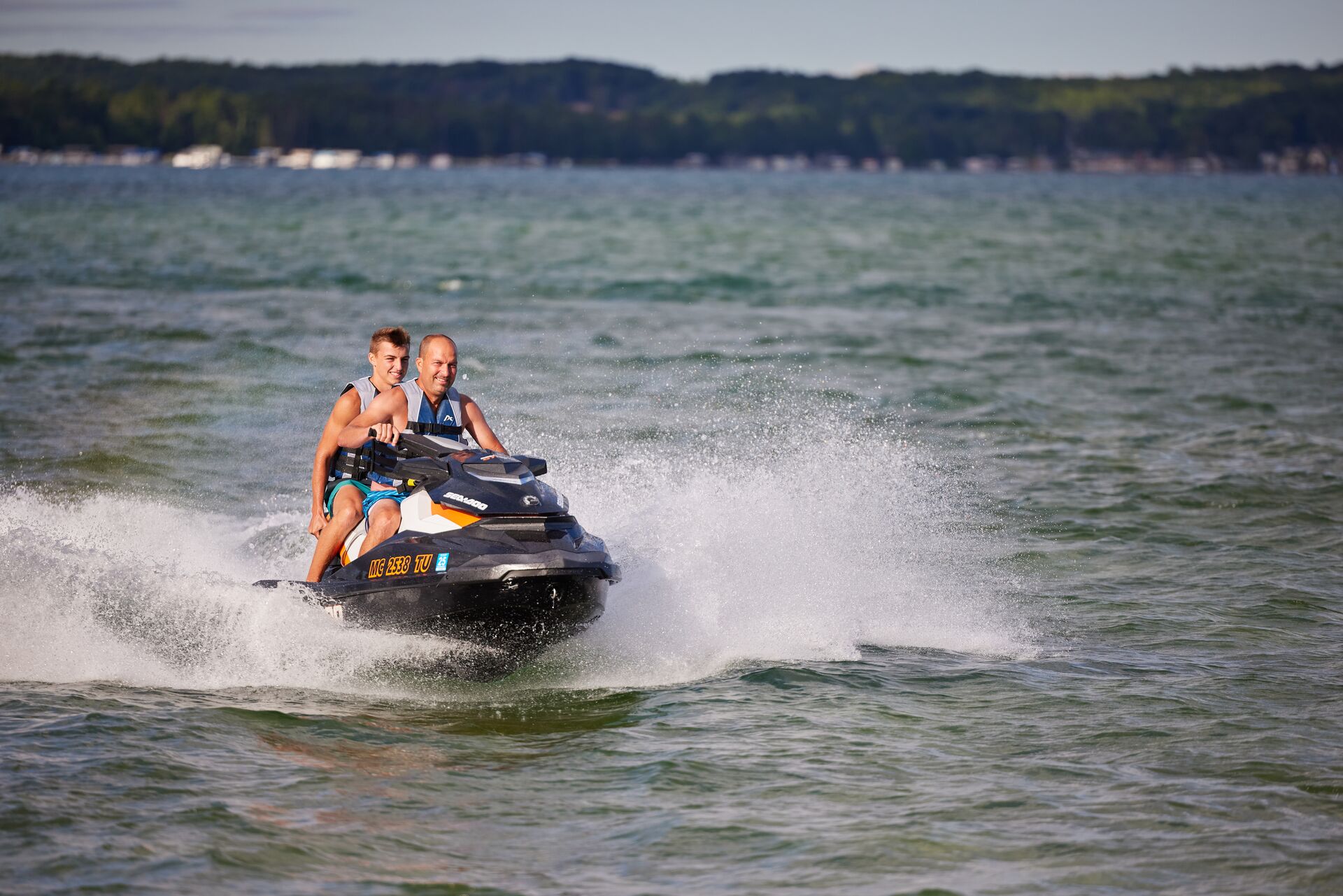 Two guys on a jet ski, basics of riding a jet ski concept. 