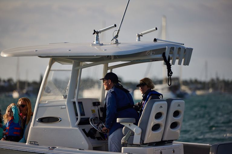 Close-up of a man driving a boat, know TN boating laws concept. 