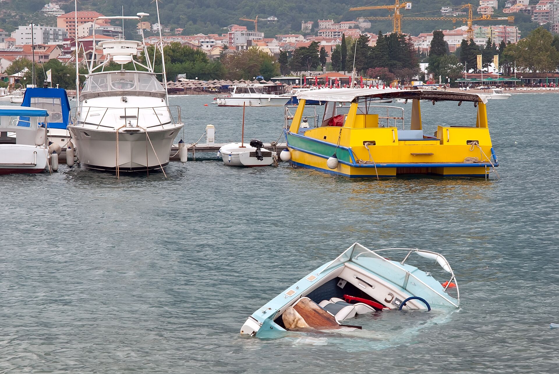 A sinking boat halfway under water. 