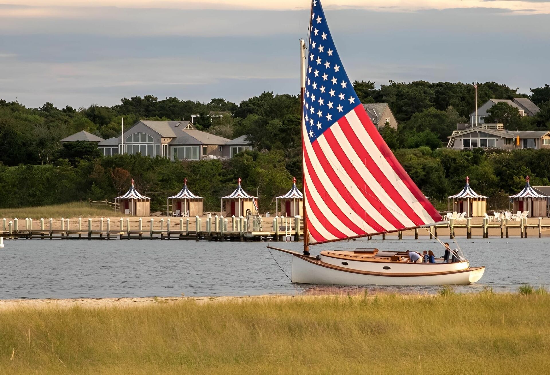 A sailboat with a large U.S. flag.
