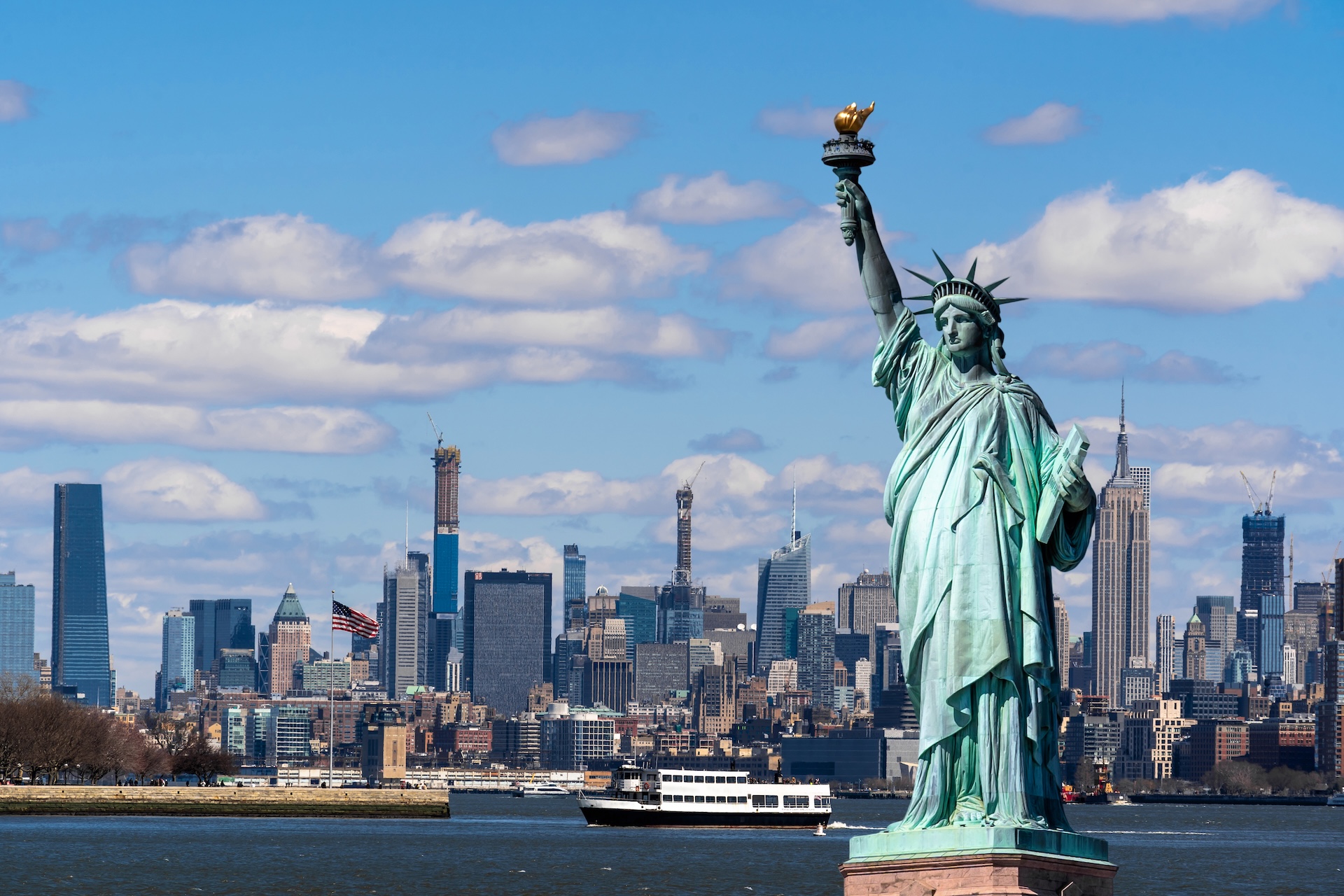  Statue of Liberty and boats on the water, boating on the Hudson concept. 