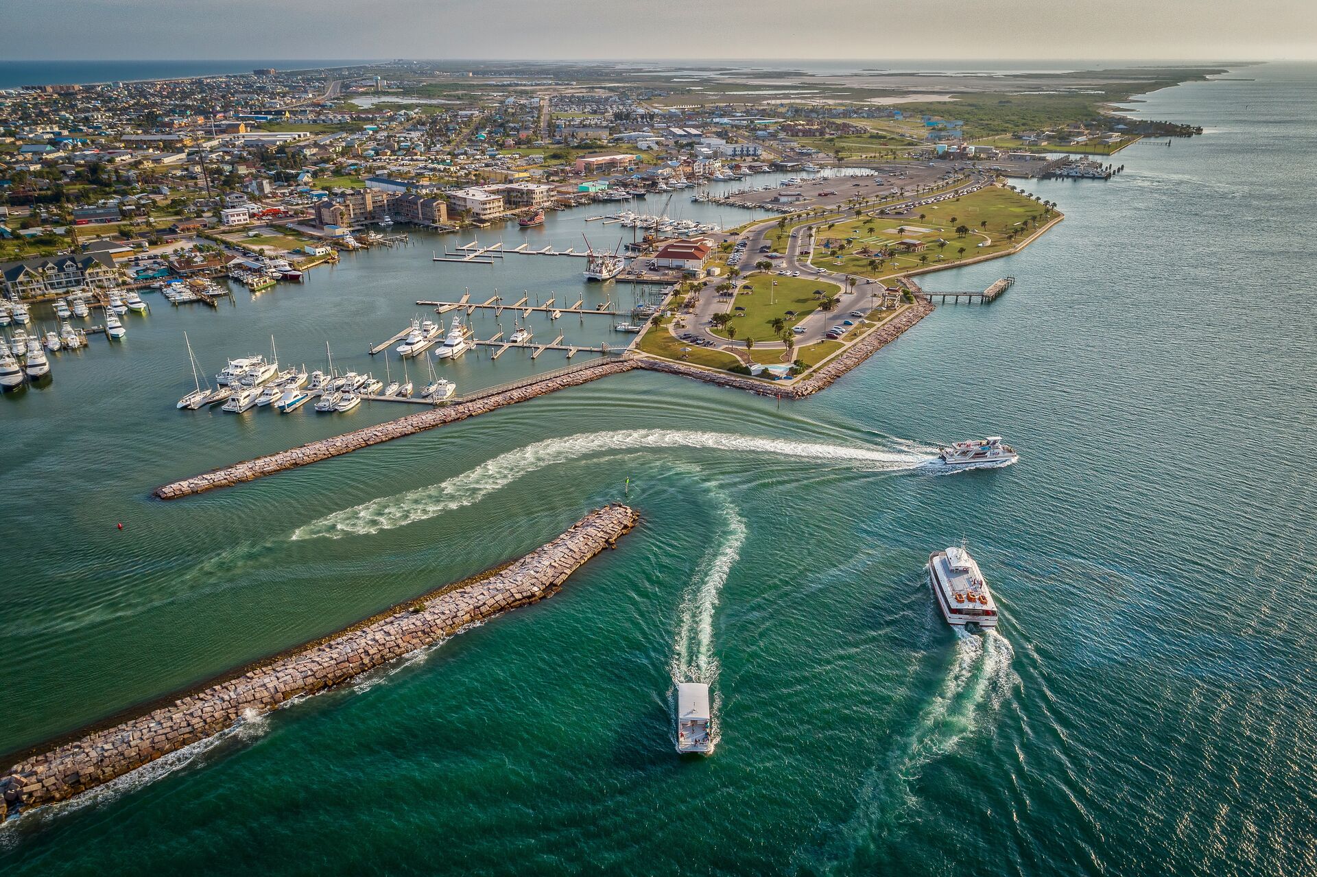 Boats moving toward and away from an inlet, avoiding a boat accident concept. 