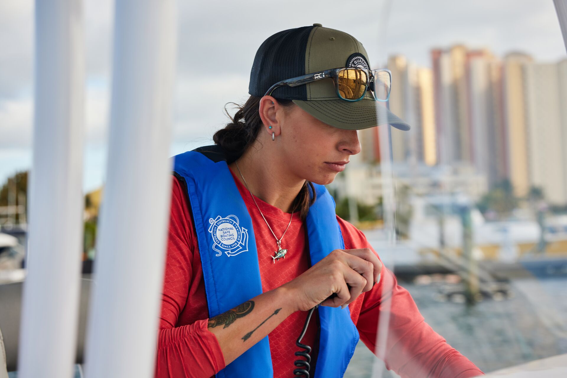 Woman using radio on boat, what to do after boat accident concept. 