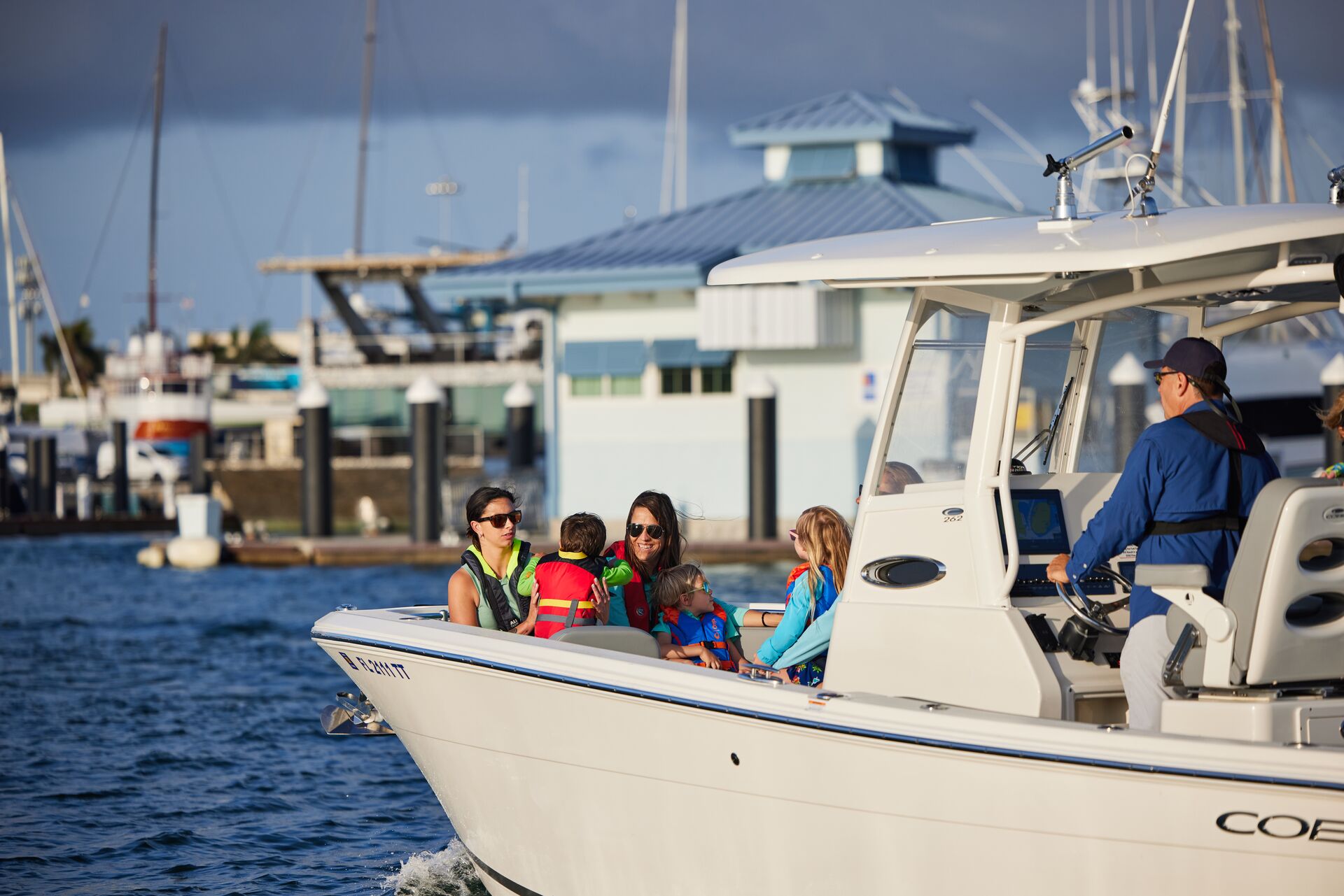 Boat full of passengers on the water, know boat horn meanings concept.
