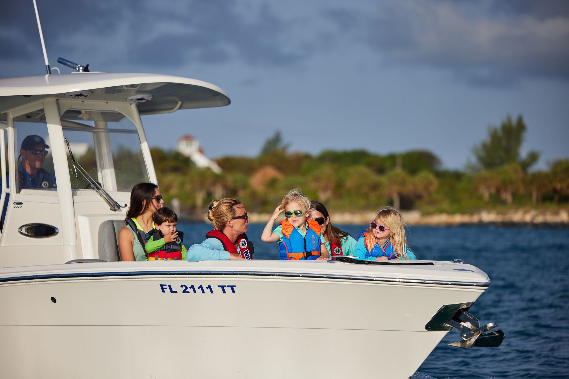 Several people in the front of a boat, boat weight limits concept. 