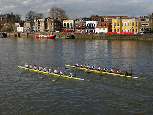 People on boats for the Oxford vs Cambridge University Boat Races.