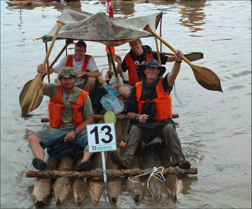 Men on a raft for the Great River Amazon Raft Race, boat races concept. 