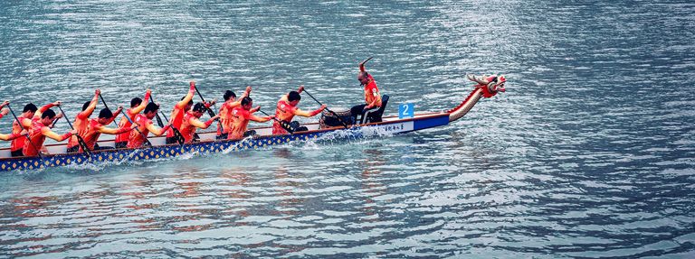 People rowing a Chundun boat, boat races concept. 