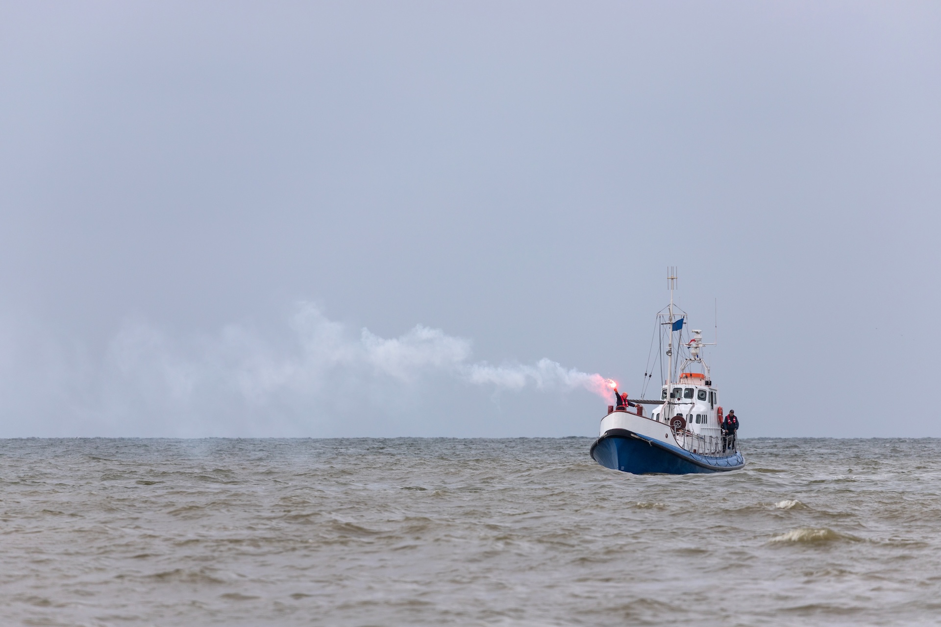 Boat in the distance using a boat flare. 