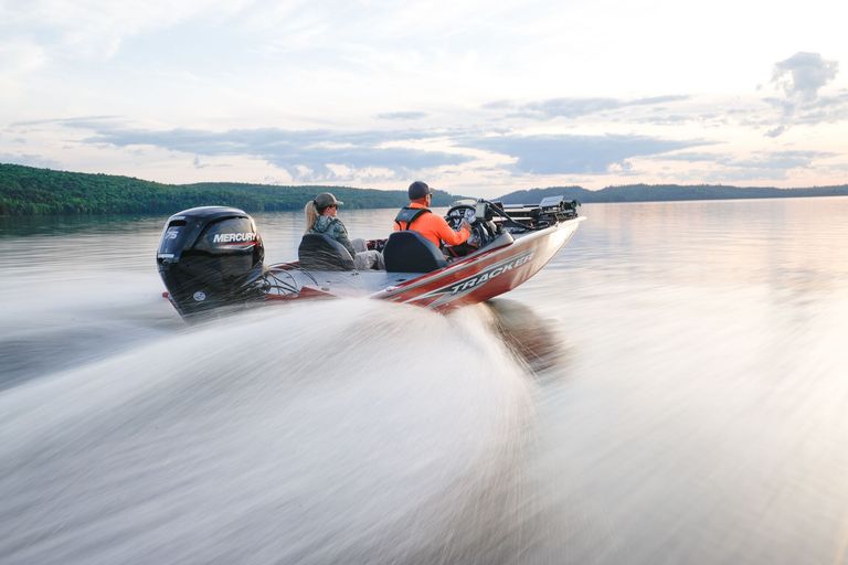 Two people in fast-moving red bass boat, how much does an Ontario boating license cost concept. 
