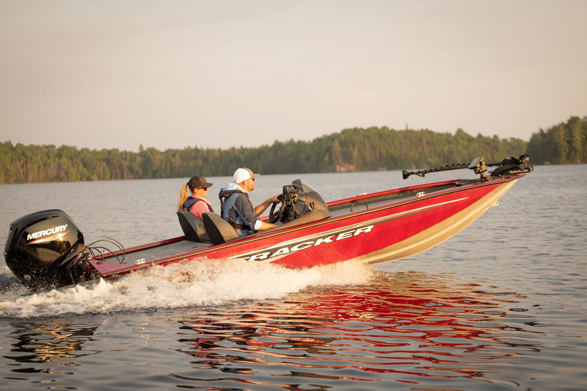 Two people in red fishing boat, how old to you have to be to get a Pleasure Craft Operator card concept. 