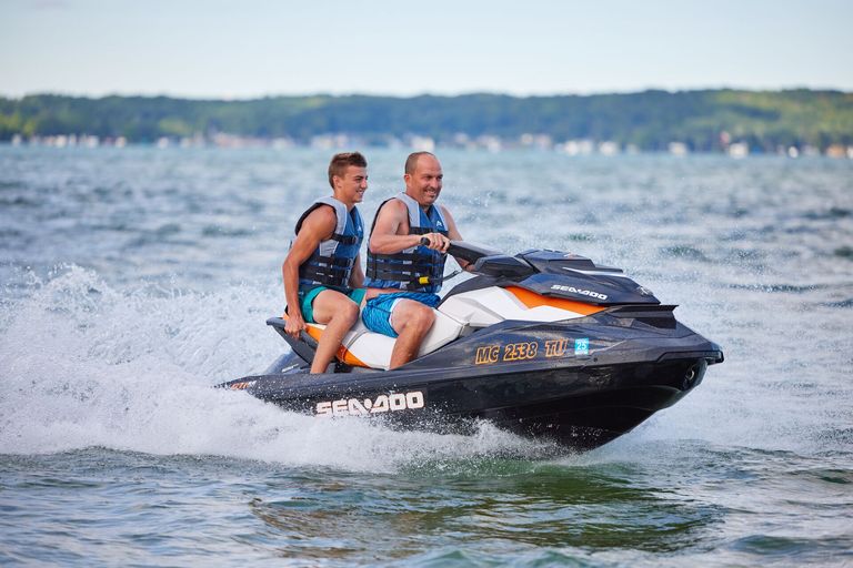 Two jet ski riders on a lake, Alberta boating license for jet ski concept.