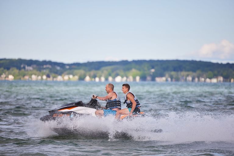 Man and boy jet ski riders, Quebec boating license for jet ski concept.