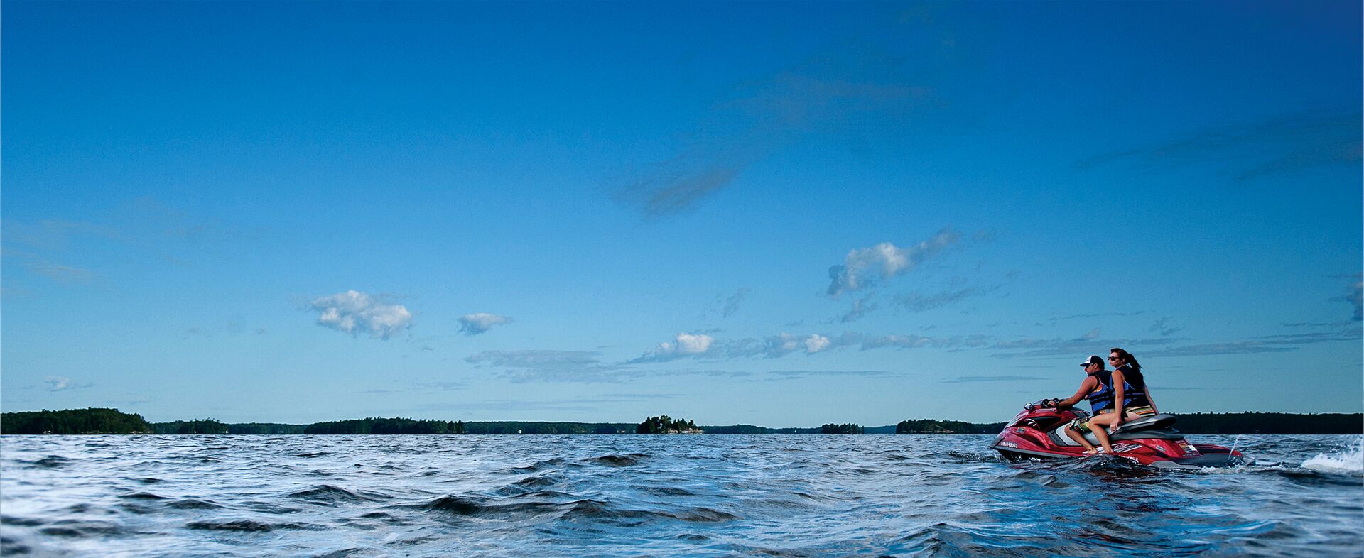 Man and woman on jet ski, boating license for jet ski in Manitoba concept.