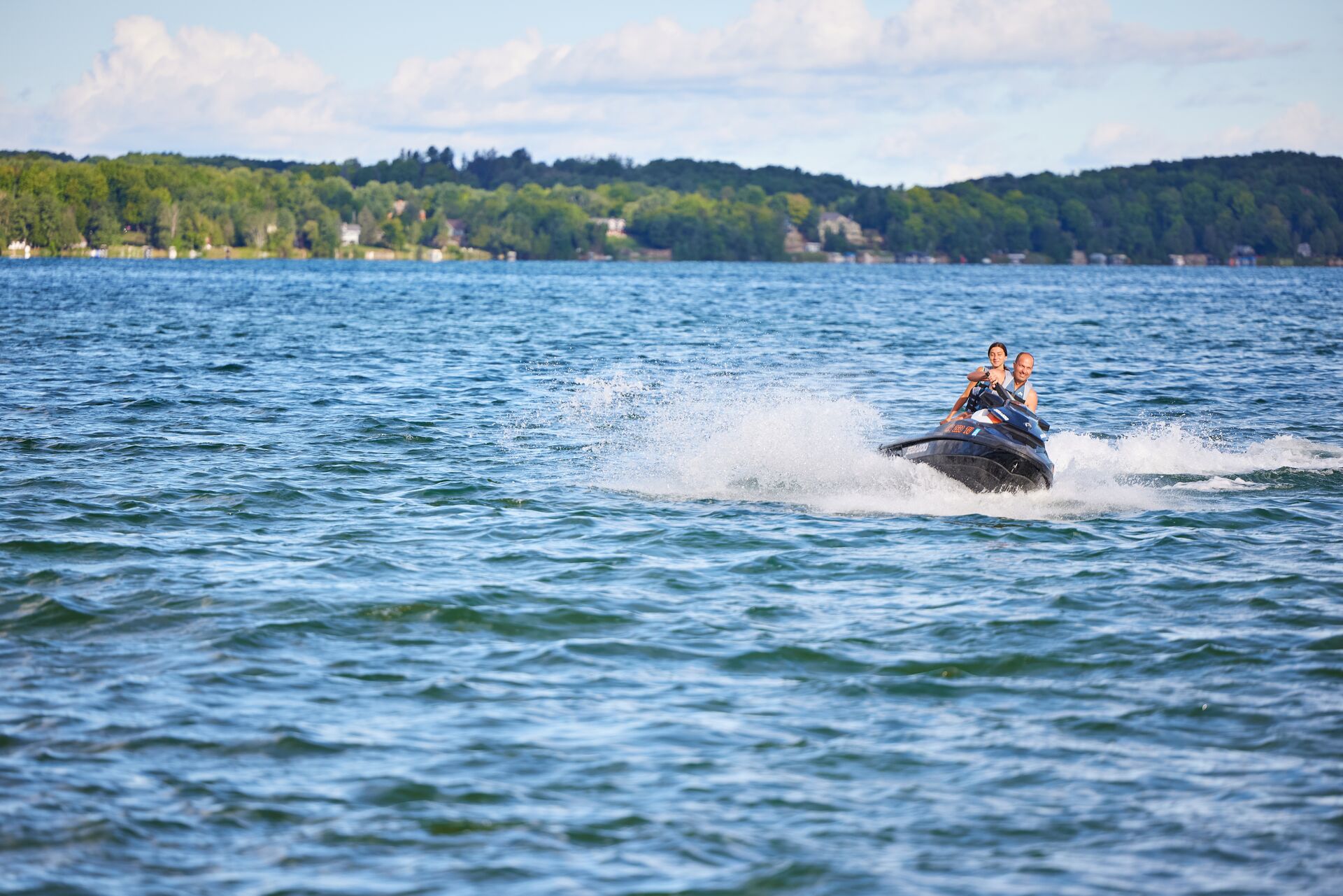 Two people on jet ski, Newfoundland and Labrador boating license for jet ski concept. 