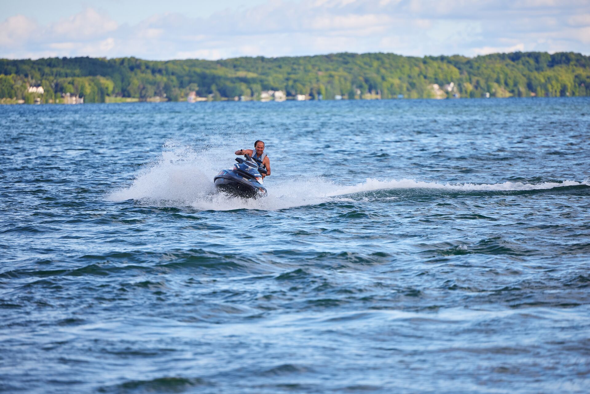 Two people on jet ski turning on the water, Prince Edward Island boating license for jet ski concept. 