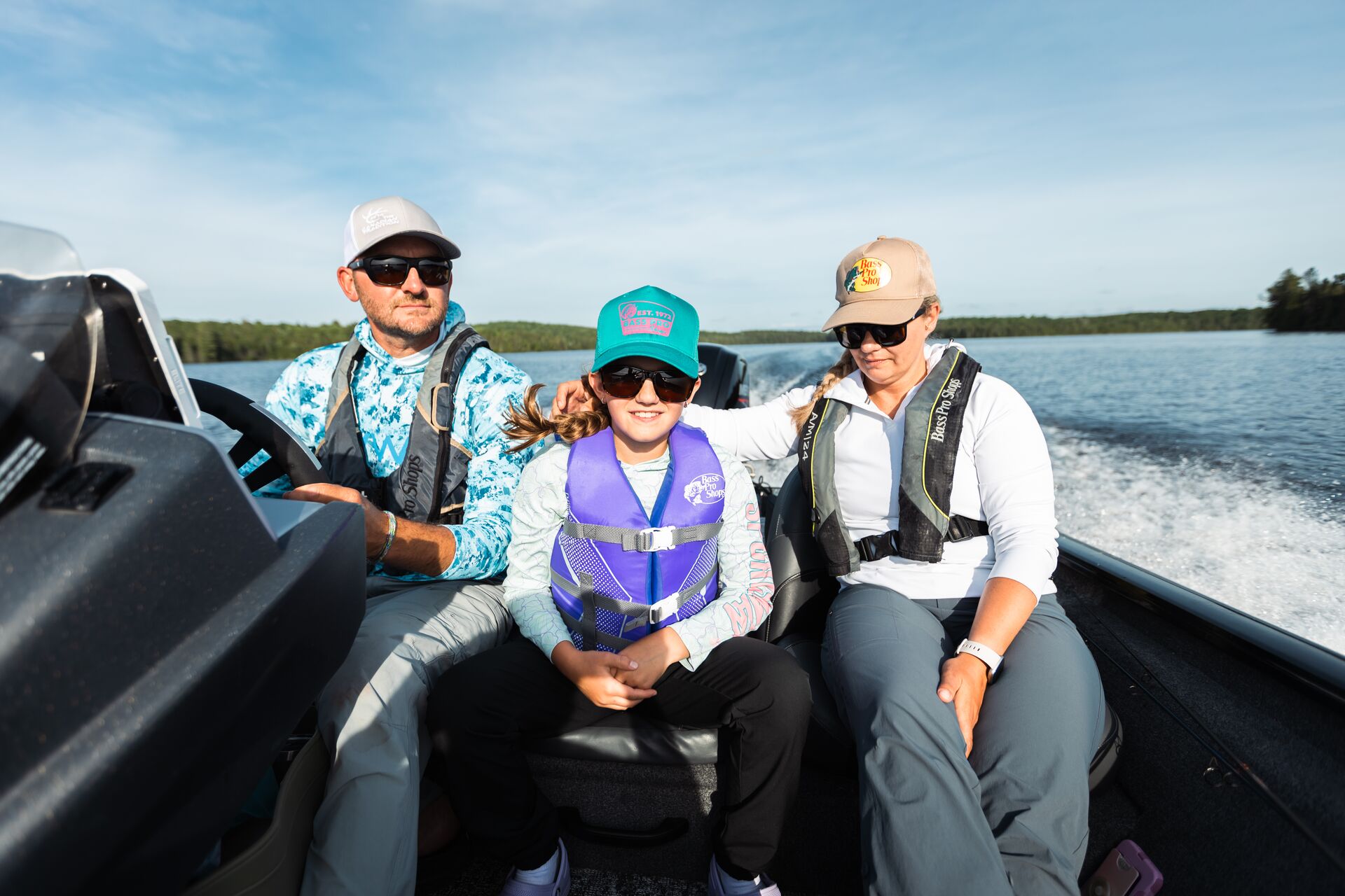 Man, woman and child on a boat, how old to operate a boat Canada concept. 