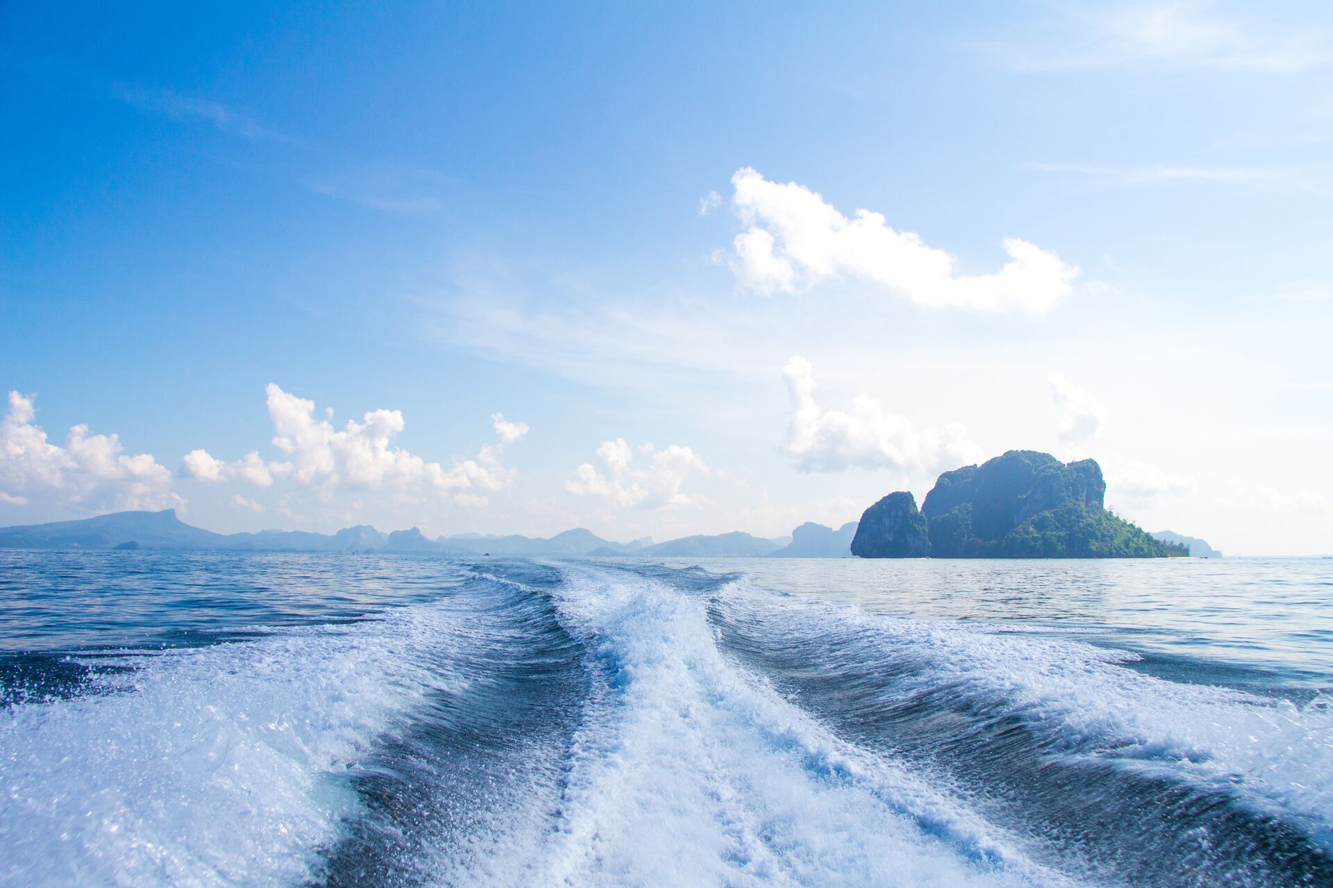 Wake and choppy water behind boat, how to drive a boat in rough water concept. 