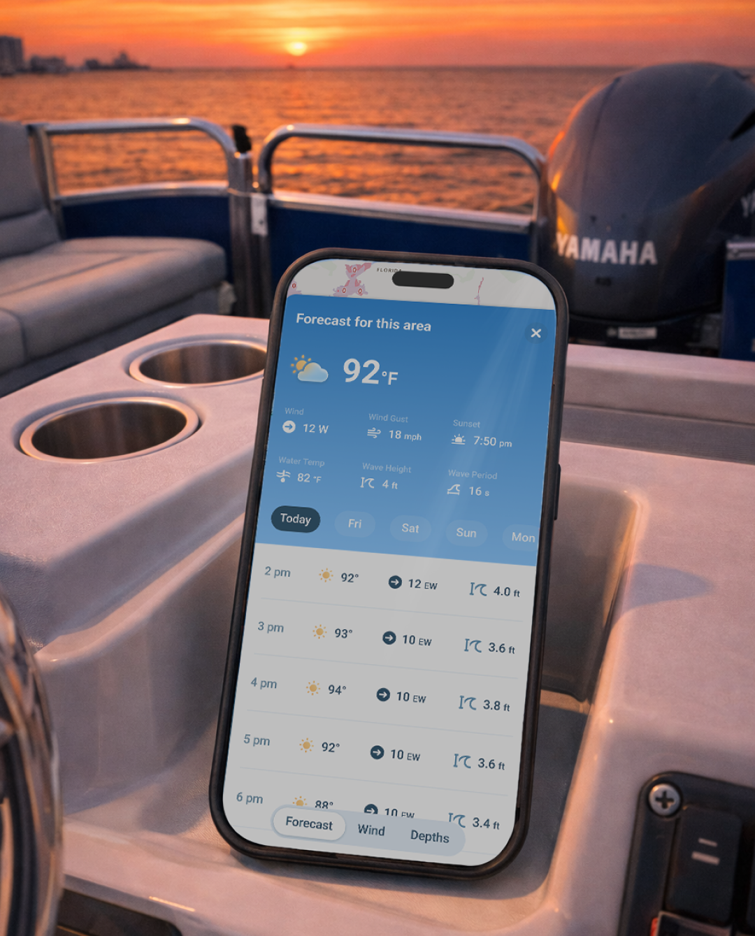 Wavve Boating app on a phone screen on a boat, navigating rough water concept. 