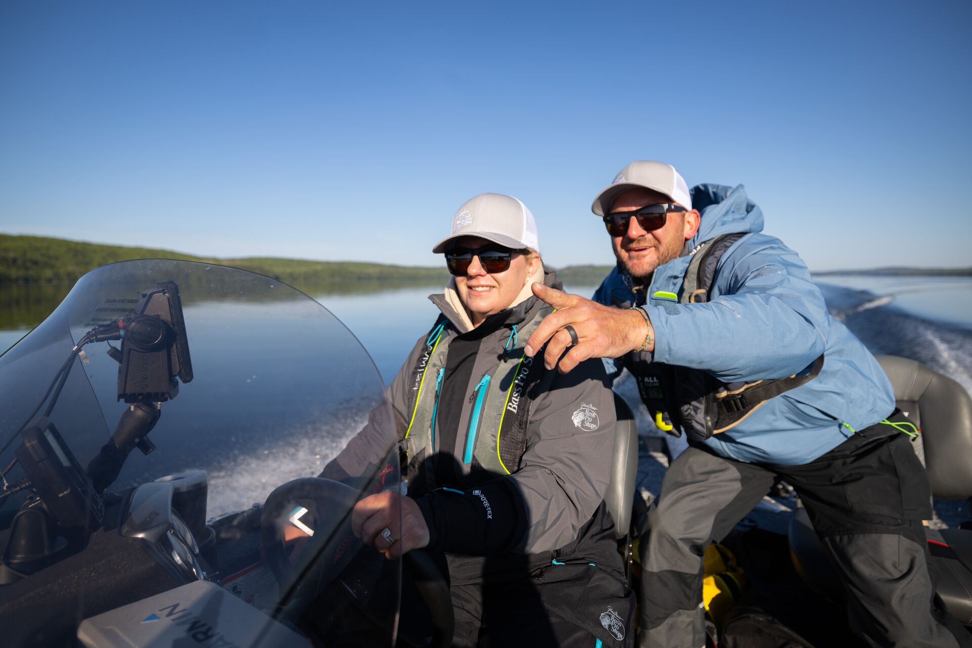 Instructor with student driving boat, rough river water level concept. 