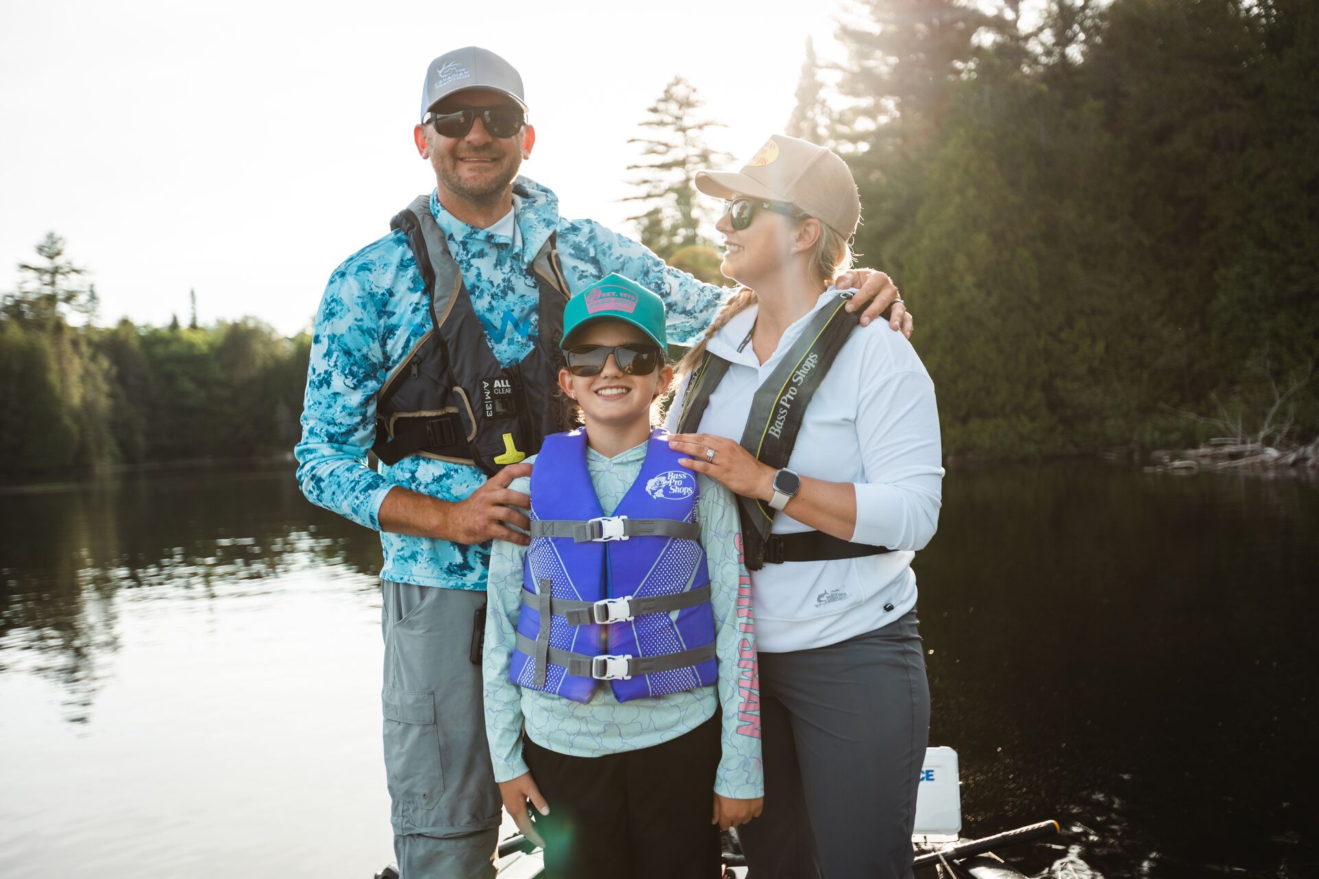 Family in lifejackets on dock, boating in Canada concept. 