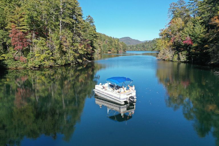 Pontoon boat on the water in the distance, is a Canadian boating license valid concept.