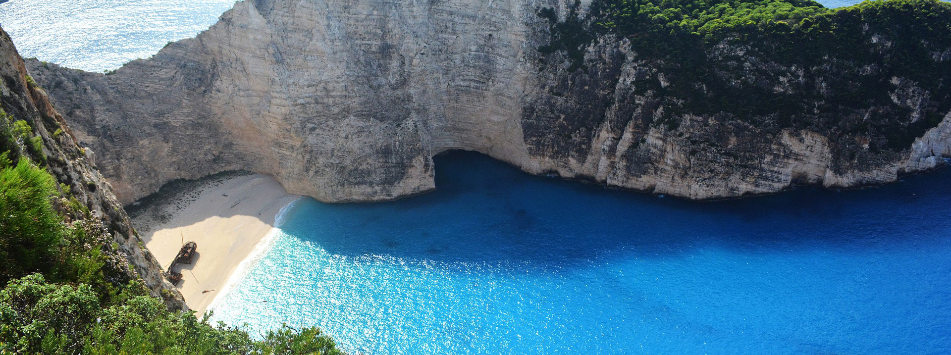 Aerial photo of secluded beach and cliffs, avoid being stranded on a deserted island concept. 