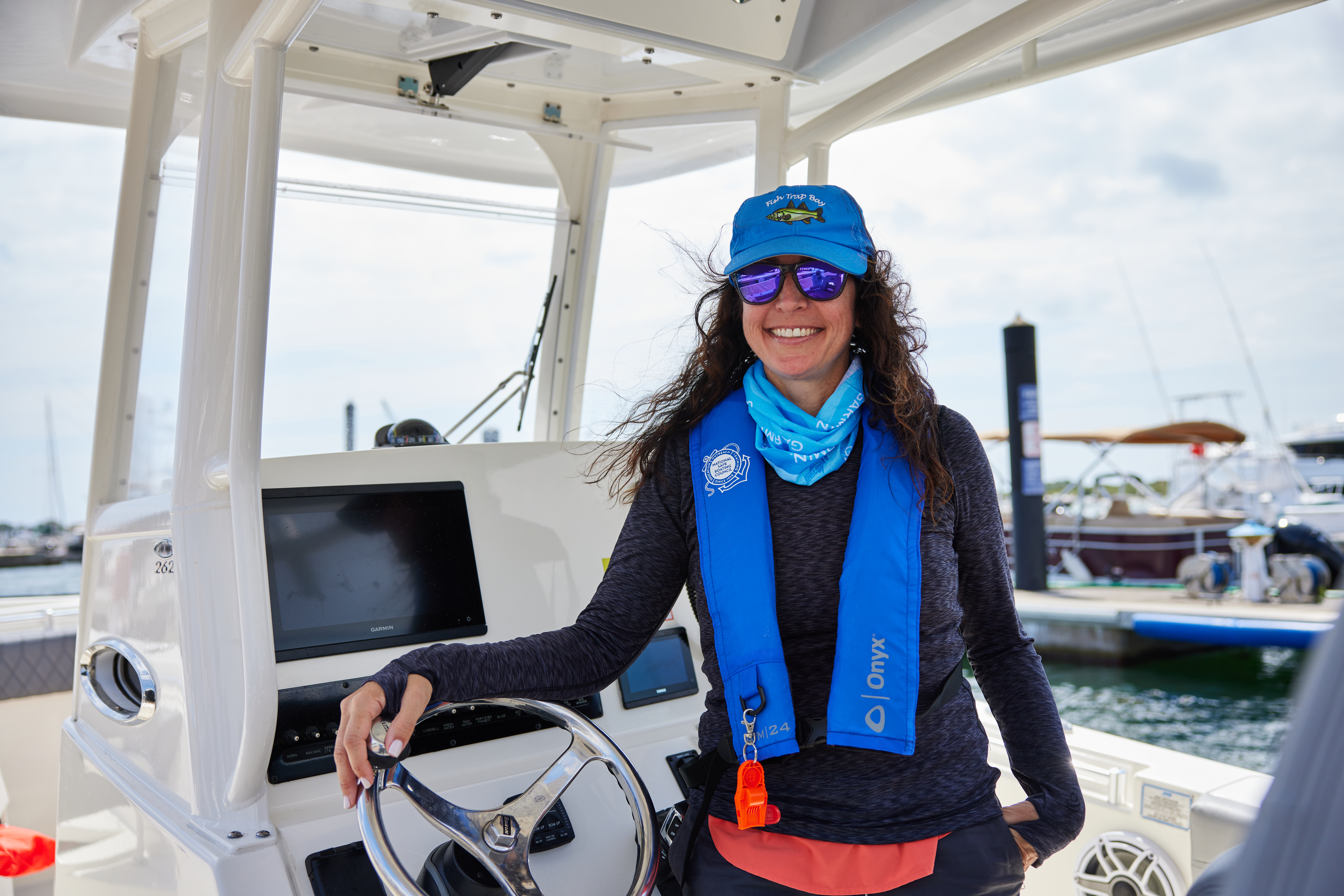 A woman wearing a PFD, boating safety concept. 