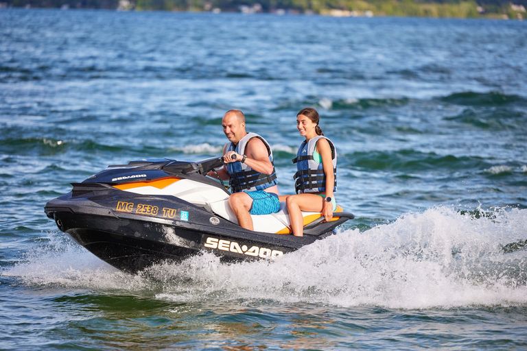 A man and girl on a PWC, is a jet ski considered a boat concept.